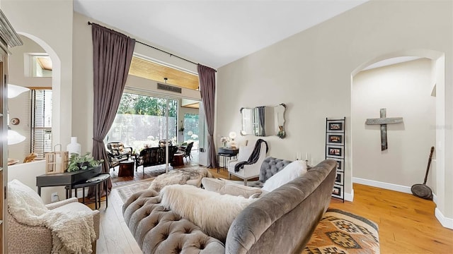 3506 Cordgrass Dr, Valrico, FL 33596 - living room featuring arched walkways and light wood-style floors