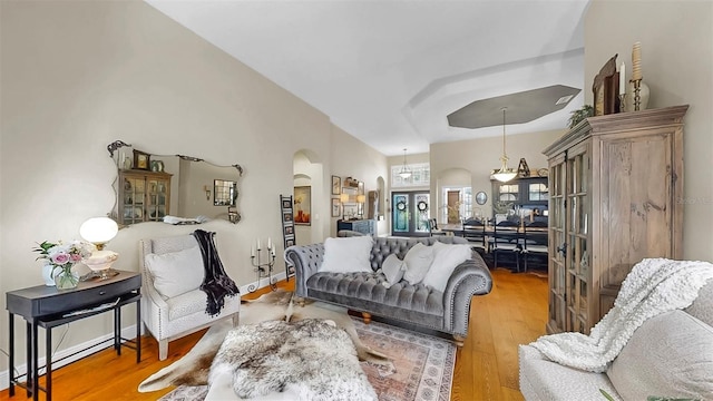 3506 Cordgrass Dr, Valrico, FL 33596 - living room with arched walkways and wood finished floors