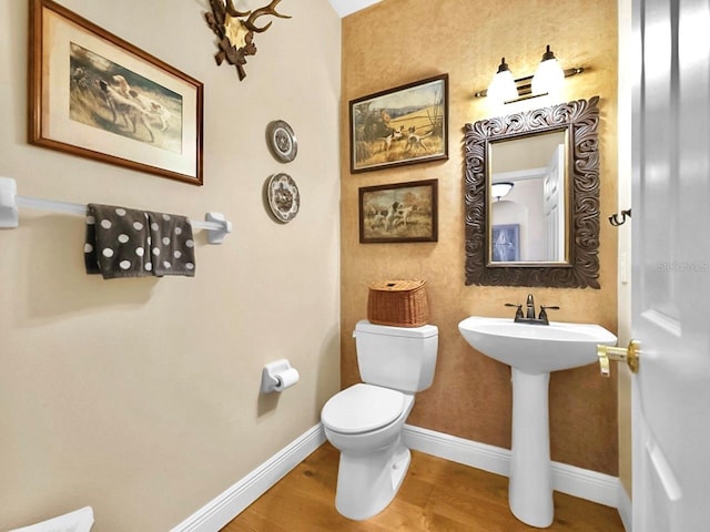 3506 Cordgrass Dr, Valrico, FL 33596 - half bath featuring toilet and wood finished floors