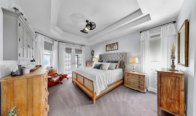 3506 Cordgrass Dr, Valrico, FL 33596 - carpeted bedroom featuring a raised ceiling and access to outside