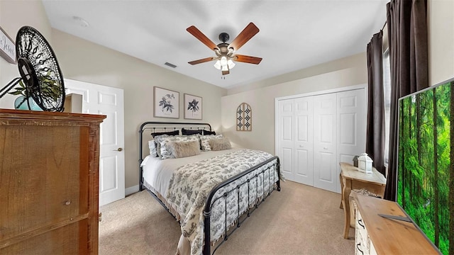 3506 Cordgrass Dr, Valrico, FL 33596 - bedroom featuring light carpet, a closet, and ceiling fan