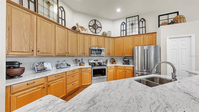 3506 Cordgrass Dr, Valrico, FL 33596 - kitchen featuring stainless steel appliances, light stone countertops, a high ceiling, and recessed lighting