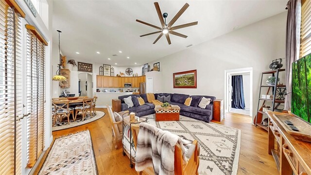 3506 Cordgrass Dr, Valrico, FL 33596 - living area with a ceiling fan, arched walkways, light wood-type flooring, and recessed lighting