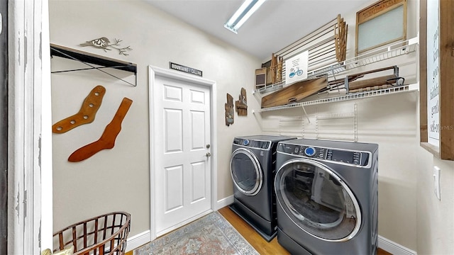 3506 Cordgrass Dr, Valrico, FL 33596 - laundry area with washing machine and dryer and wood finished floors