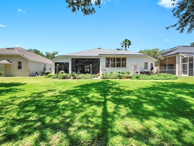 3506 Cordgrass Dr, Valrico, FL 33596 - back of property featuring a sunroom, a yard, and stucco siding
