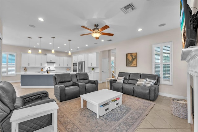 6207 Bleeker St, Riverview, FL 33578 - living room with plenty of natural light, a ceiling fan, light tile patterned floors, and recessed lighting