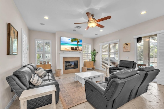 6207 Bleeker St, Riverview, FL 33578 - living area with ceiling fan, plenty of natural light, light tile patterned floors, a glass covered fireplace, and recessed lighting