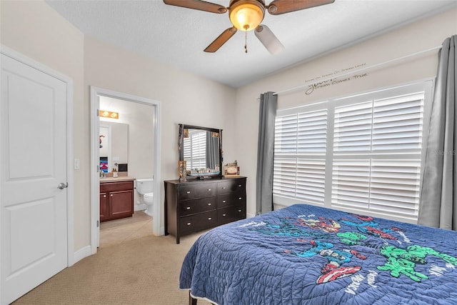 6207 Bleeker St, Riverview, FL 33578 - bedroom featuring light carpet, a ceiling fan, and ensuite bathroom