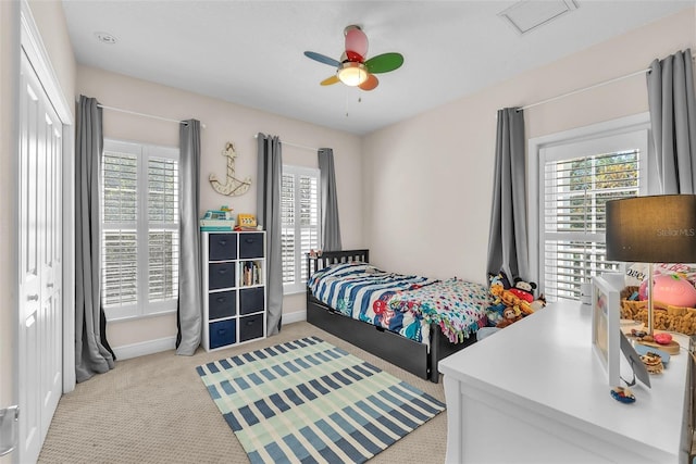 6207 Bleeker St, Riverview, FL 33578 - carpeted bedroom with multiple windows and ceiling fan
