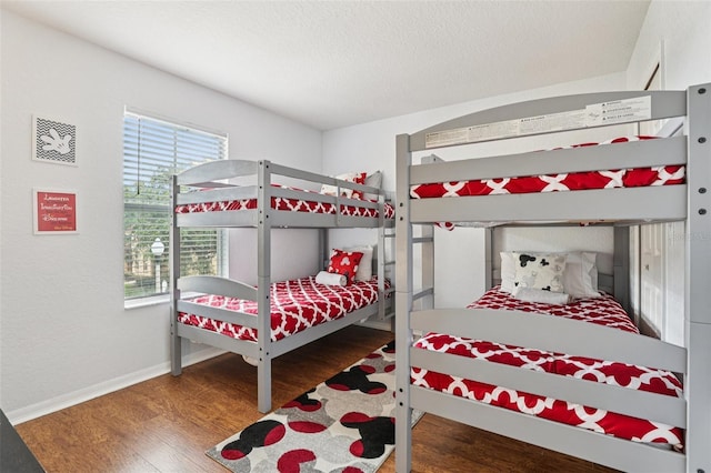 1052 Calabria Ave, Davenport, FL 33897 - bedroom with wood finished floors and a textured ceiling