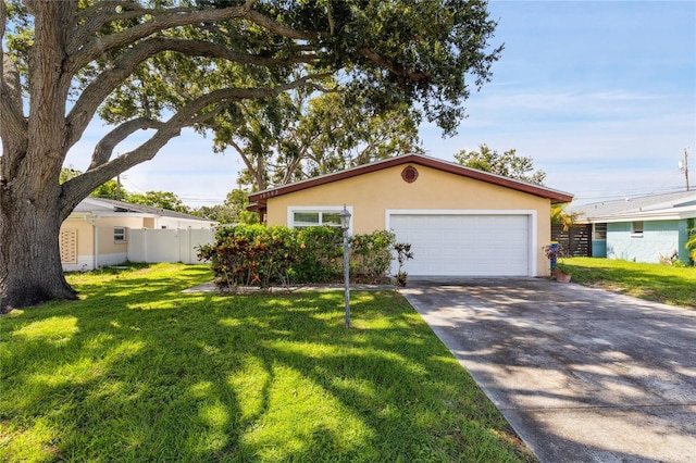 10502 Orange Blossom Ln, Seminole, FL 33772 - view of front of home with stucco siding, driveway, and an attached garage