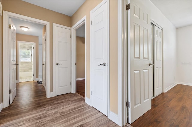 10502 Orange Blossom Ln, Seminole, FL 33772 - corridor featuring dark wood-style flooring