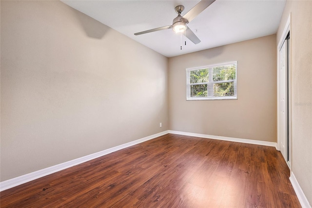 10502 Orange Blossom Ln, Seminole, FL 33772 - unfurnished bedroom with a closet, dark wood finished floors, and ceiling fan