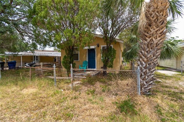 1144AND1142 7th St NW, Largo, FL 33770 - view of front of home with a fenced front yard and stucco siding