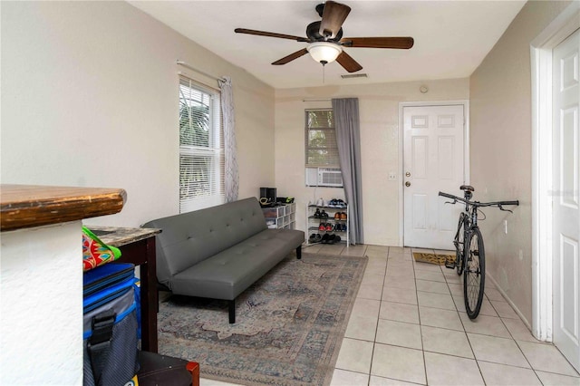 1144AND1142 7th St NW, Largo, FL 33770 - living room with a ceiling fan, light tile patterned flooring, and cooling unit