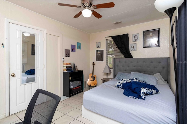 1144AND1142 7th St NW, Largo, FL 33770 - bedroom with light tile patterned floors and a ceiling fan