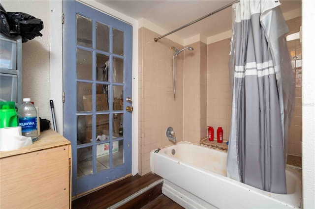 1144AND1142 7th St NW, Largo, FL 33770 - bathroom featuring shower / tub combo with curtain, wood finished floors, and vanity