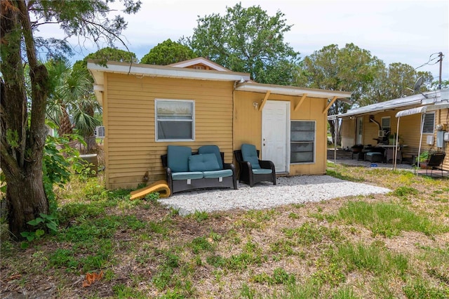 1144AND1142 7th St NW, Largo, FL 33770 - back of property with a patio area