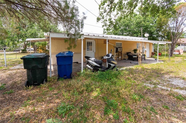 1144AND1142 7th St NW, Largo, FL 33770 - back of house with a carport