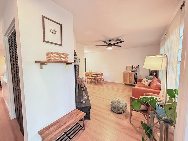 1972 Briarwood St, Dunedin, FL 34698 - living room featuring light wood finished floors and a ceiling fan
