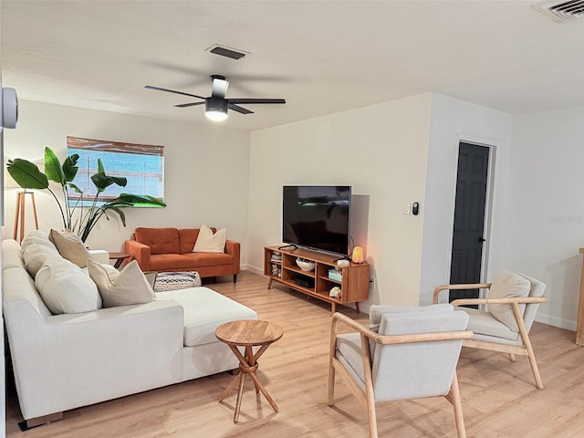 1972 Briarwood St, Dunedin, FL 34698 - living room featuring light wood-type flooring and ceiling fan