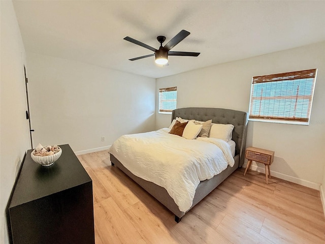 1972 Briarwood St, Dunedin, FL 34698 - bedroom featuring light wood finished floors and ceiling fan