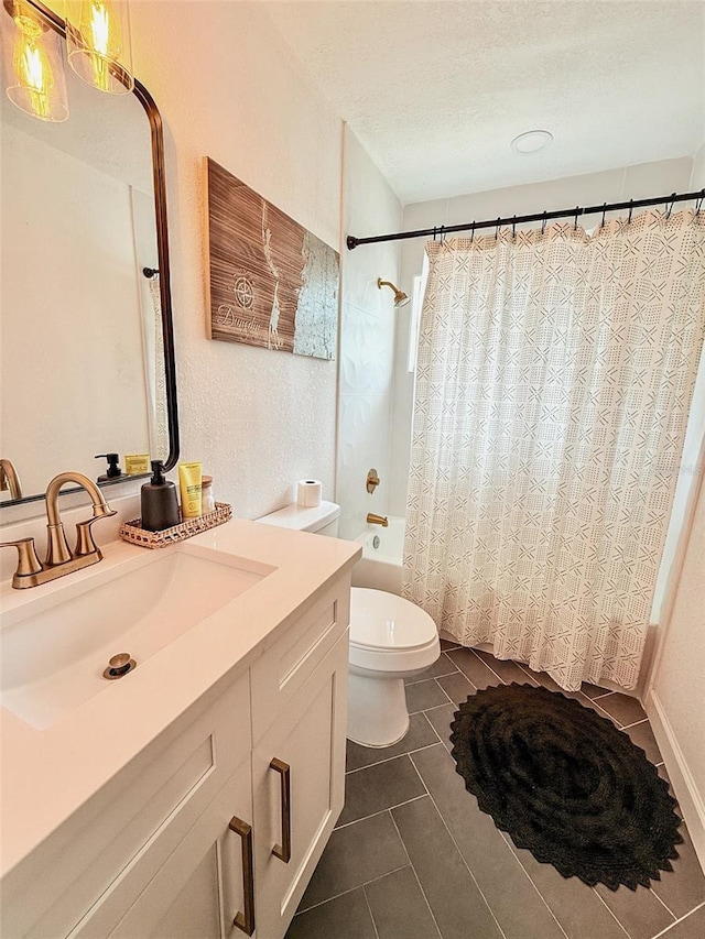 1972 Briarwood St, Dunedin, FL 34698 - bathroom with vanity, shower / bath combination with curtain, tile patterned floors, and a textured ceiling