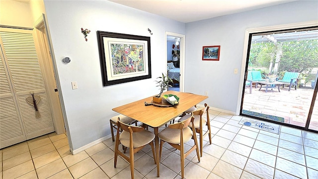 13 Windrush Bay Dr, Tarpon Springs, FL 34689 - dining space with light tile patterned floors and baseboards