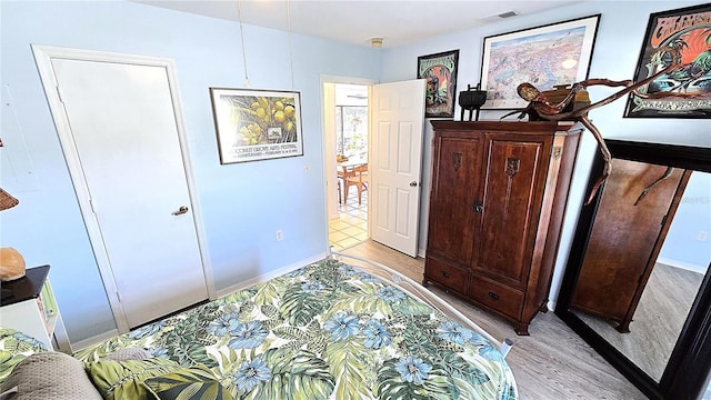 13 Windrush Bay Dr, Tarpon Springs, FL 34689 - bedroom featuring light wood-type flooring