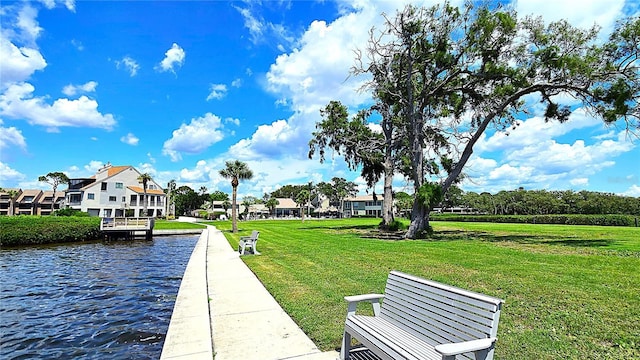 13 Windrush Bay Dr, Tarpon Springs, FL 34689 - surrounding community with a water view and a lawn