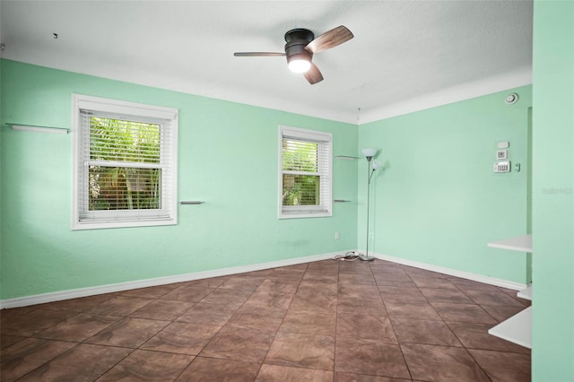 487 49th Ave N, Saint Petersburg, FL 33703 - spare room featuring ceiling fan and baseboards