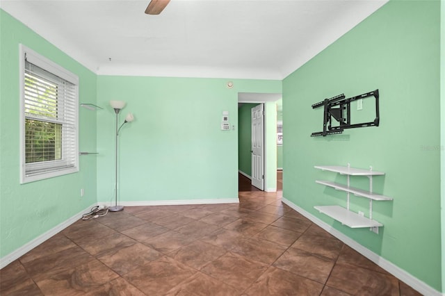 487 49th Ave N, Saint Petersburg, FL 33703 - empty room with a ceiling fan and baseboards