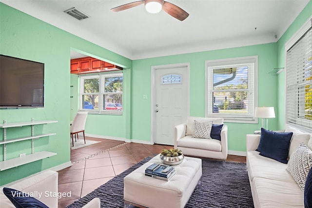 487 49th Ave N, Saint Petersburg, FL 33703 - tiled living room featuring healthy amount of natural light and a ceiling fan