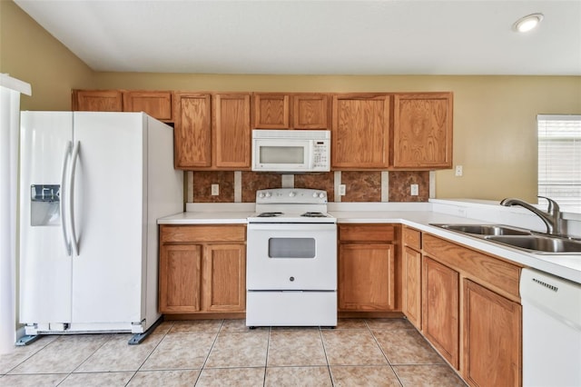8020 Carriage Pointe Dr, Gibsonton, FL 33534 - kitchen featuring white appliances, light countertops, brown cabinetry, and tasteful backsplash