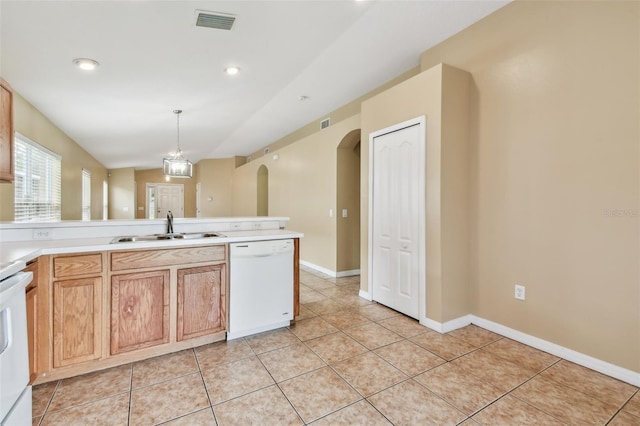 8020 Carriage Pointe Dr, Gibsonton, FL 33534 - kitchen with dishwasher, arched walkways, light tile patterned floors, light countertops, and pendant lighting