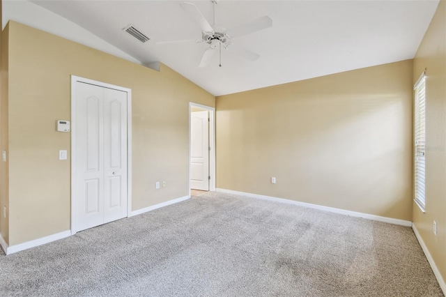 8020 Carriage Pointe Dr, Gibsonton, FL 33534 - unfurnished bedroom featuring vaulted ceiling, carpet floors, a closet, and a ceiling fan