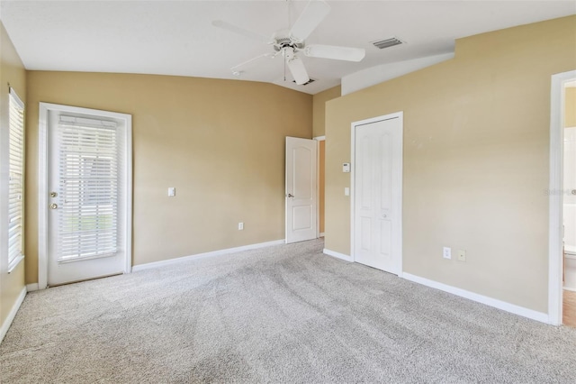 8020 Carriage Pointe Dr, Gibsonton, FL 33534 - unfurnished bedroom featuring carpet floors, vaulted ceiling, a ceiling fan, and access to outside