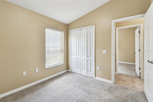 8020 Carriage Pointe Dr, Gibsonton, FL 33534 - unfurnished bedroom with carpet flooring, vaulted ceiling, and a closet