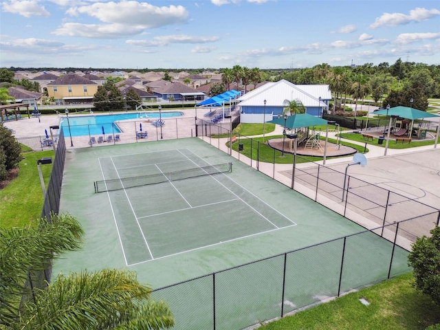 8020 Carriage Pointe Dr, Gibsonton, FL 33534 - view of tennis court with a community pool
