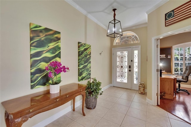 8704 Winsome Way, Land O Lakes, FL 34637 - entrance foyer with crown molding and light tile patterned floors