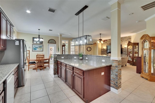 8704 Winsome Way, Land O Lakes, FL 34637 - kitchen with decorative columns, ornamental molding, light tile patterned floors, pendant lighting, and white dishwasher