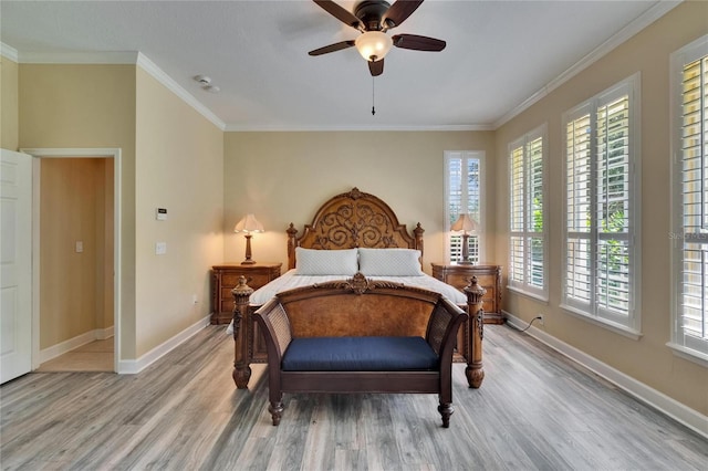 8704 Winsome Way, Land O Lakes, FL 34637 - bedroom featuring light wood finished floors, ornamental molding, and ceiling fan