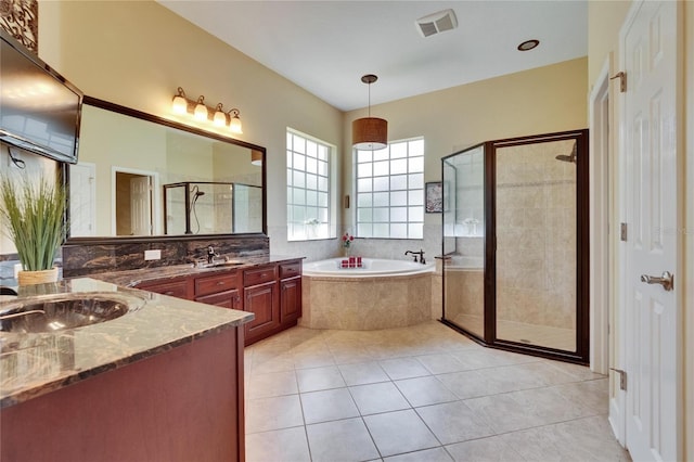 8704 Winsome Way, Land O Lakes, FL 34637 - full bath featuring a garden tub, a shower stall, vanity, and tile patterned flooring