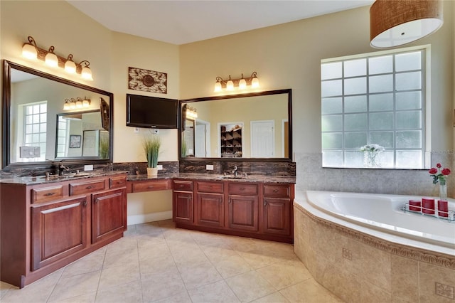 8704 Winsome Way, Land O Lakes, FL 34637 - bathroom with tile patterned flooring, a garden tub, and vanity
