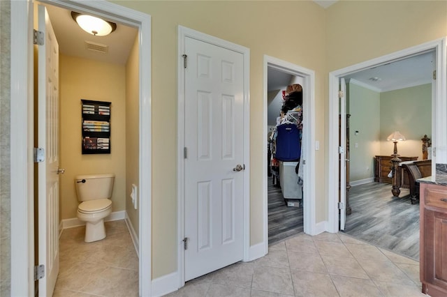 8704 Winsome Way, Land O Lakes, FL 34637 - bathroom with tile patterned flooring and a walk in closet
