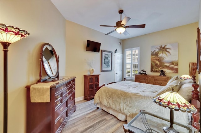 8704 Winsome Way, Land O Lakes, FL 34637 - bedroom featuring light wood finished floors and a ceiling fan