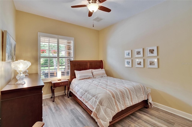 8704 Winsome Way, Land O Lakes, FL 34637 - bedroom with wood finished floors and ceiling fan