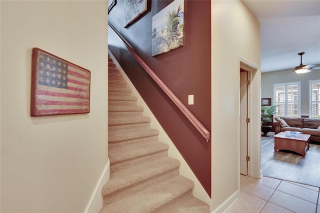8704 Winsome Way, Land O Lakes, FL 34637 - stairway featuring ceiling fan and tile patterned flooring