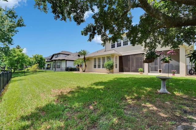 8704 Winsome Way, Land O Lakes, FL 34637 - back of house with stucco siding and a sunroom