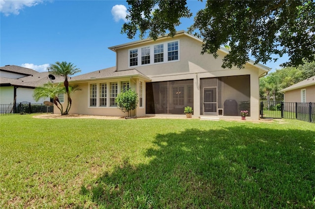 8704 Winsome Way, Land O Lakes, FL 34637 - back of house with stucco siding, a fenced backyard, and a sunroom